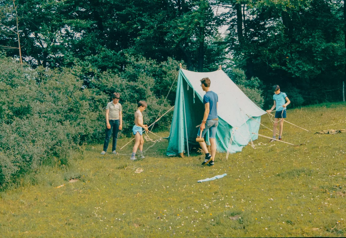Friends setting up camp