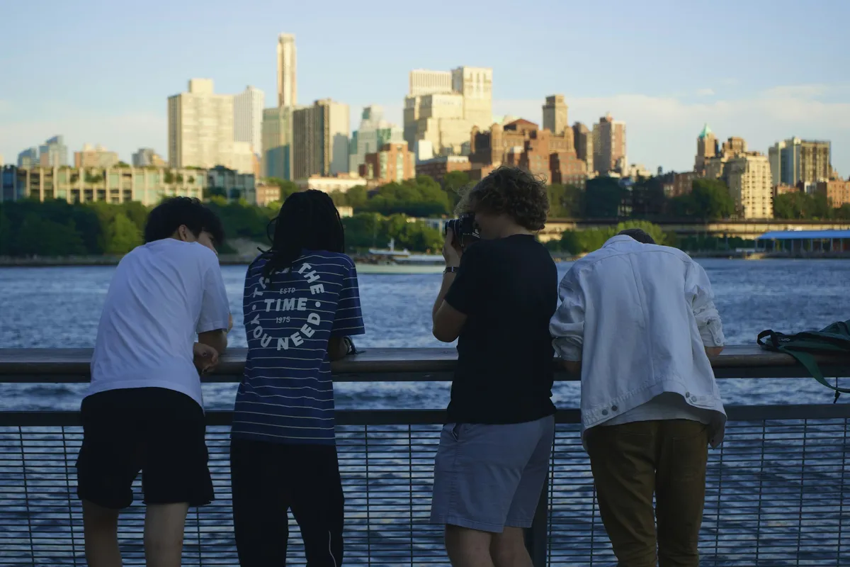 Friends watching the skyline from the waterfront